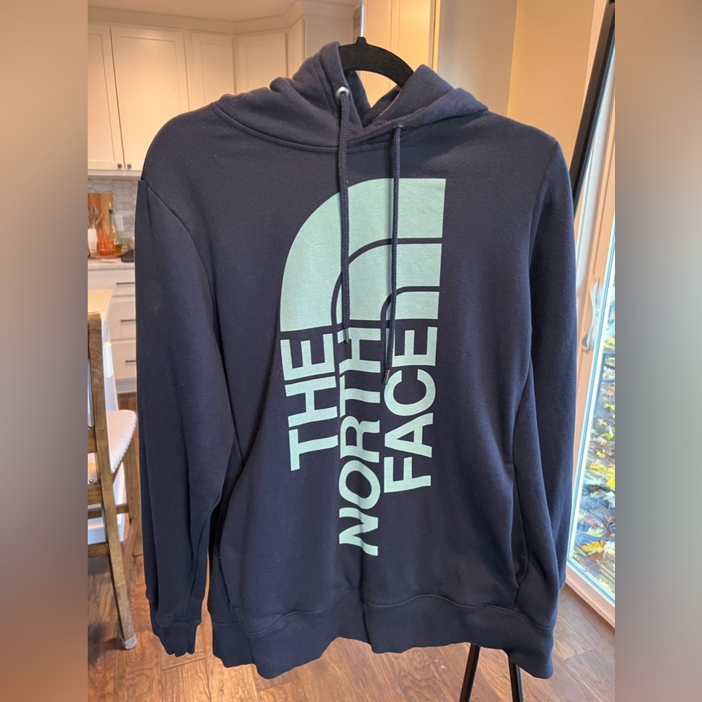 Navy North Face hoodie. Never worn, tag off. Women’s Large